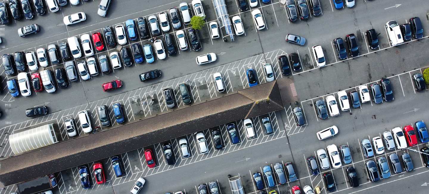 Aerial view of a busy surface car park