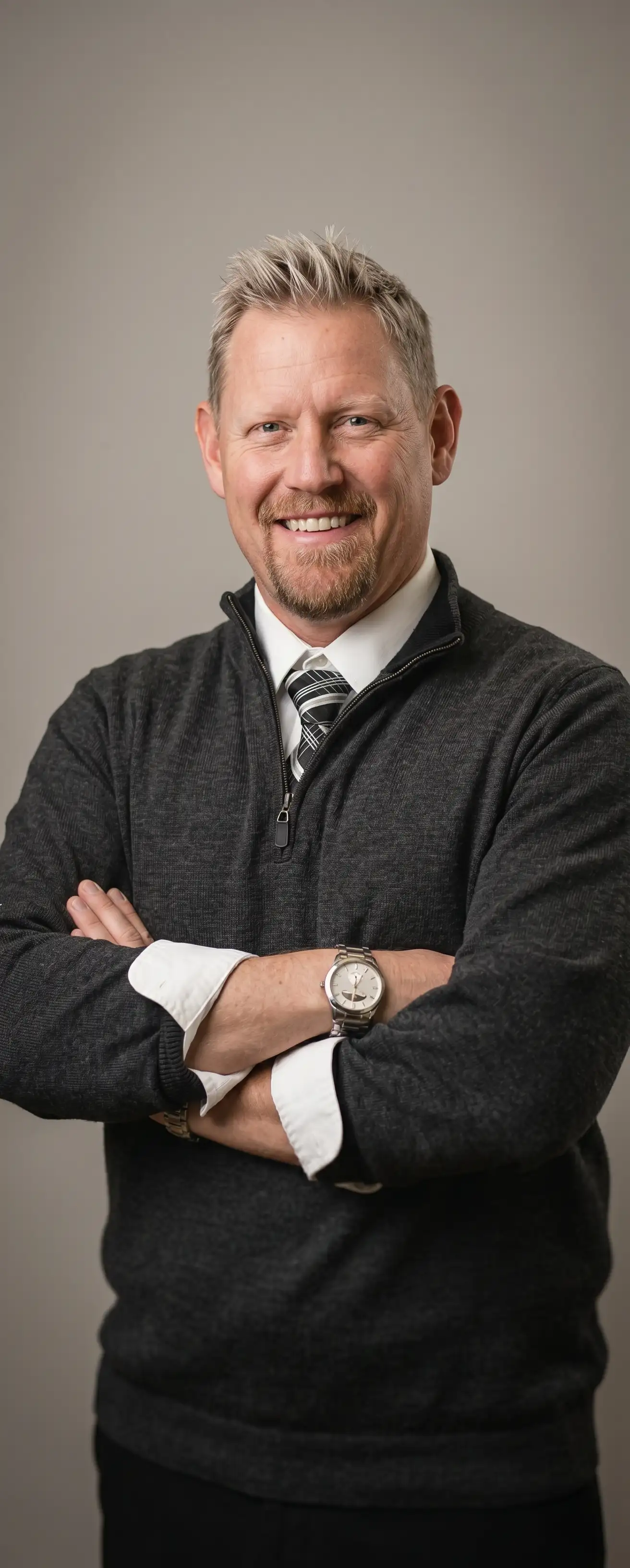 Portrait of James Downing standing in a studio lighting setting