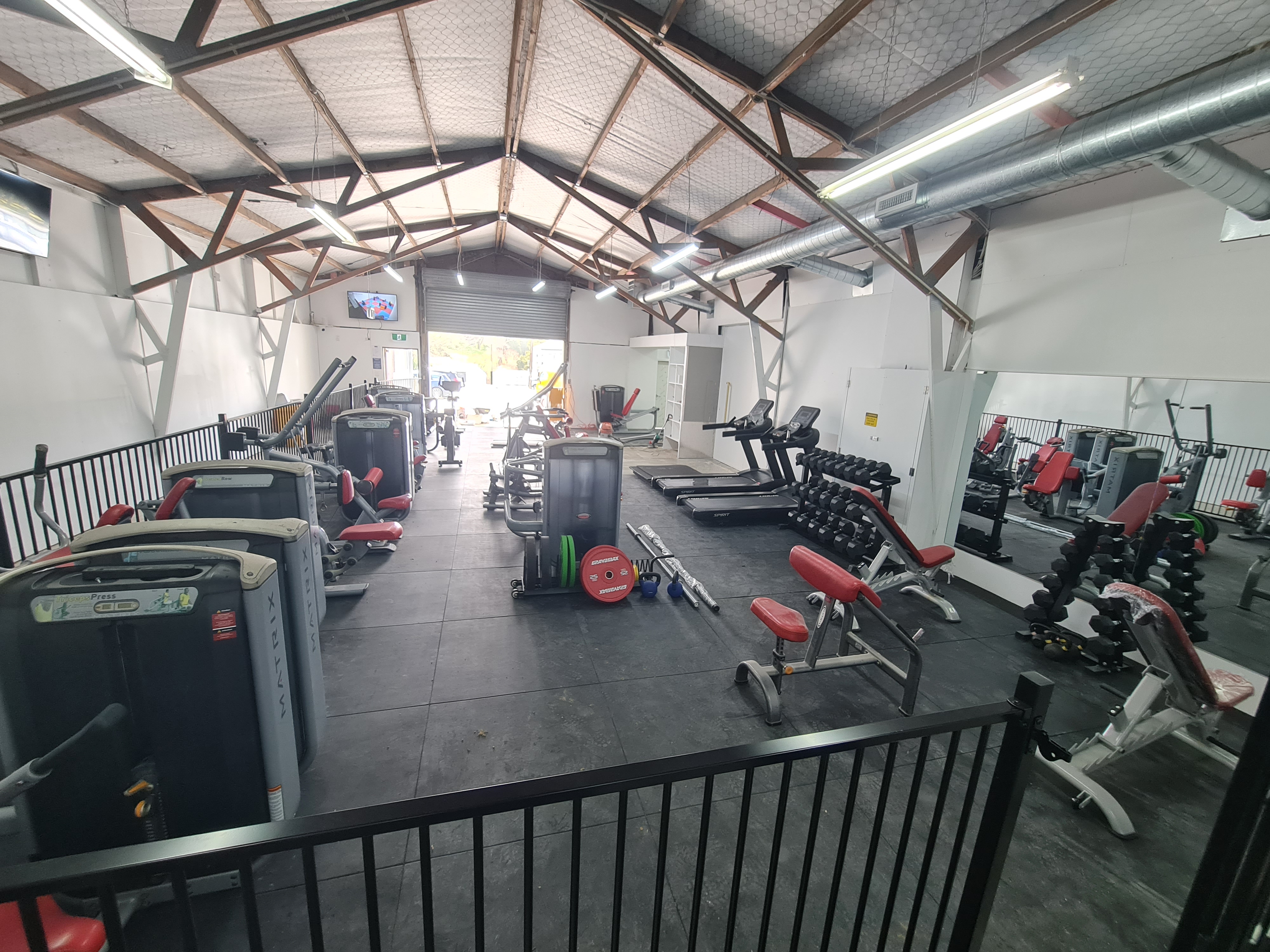 The Maungaturoto Family Fitness gym floor, fully fitted out with machines, treadmills, dumbbells and benches