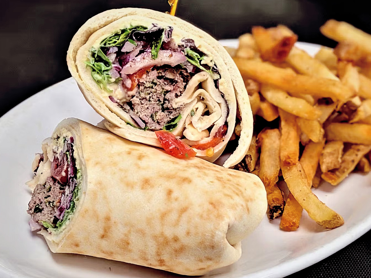 sandwich wrap and fries on a plate