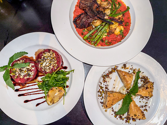 three plates of food on a table