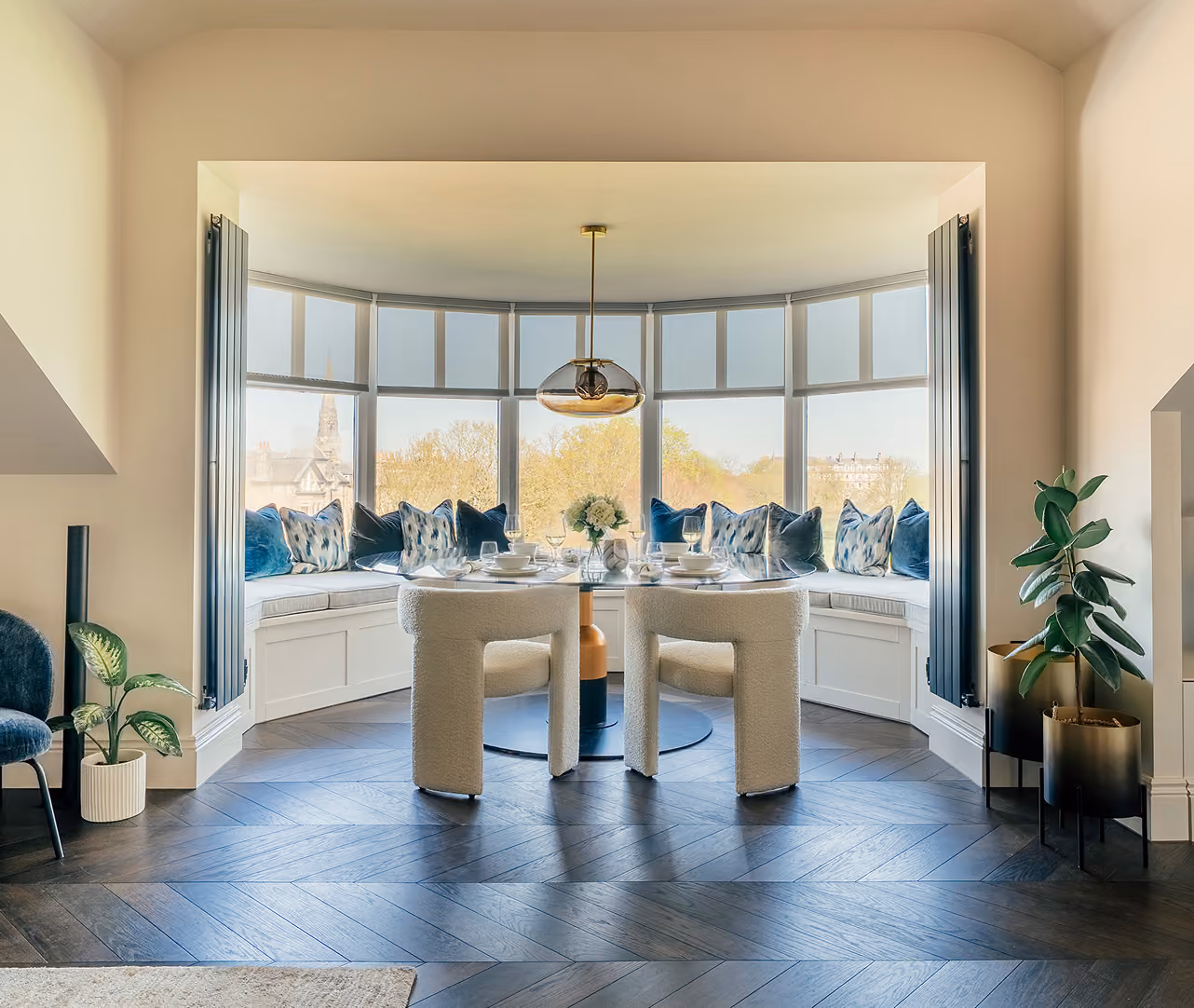 Dining table in a bay window in a Harrogate apartment