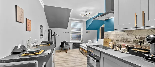 Modern open-plan kitchen and dining area in a Downtown Studio apartment on Station Parade, Harrogate