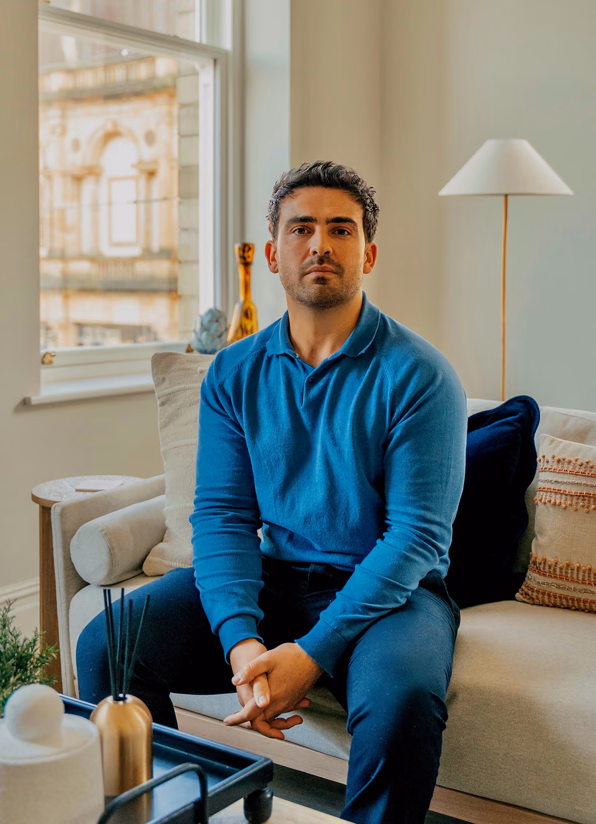 image of Youcef Scott, Founder and MD of Short Stay Harrogate sat in one of the properties