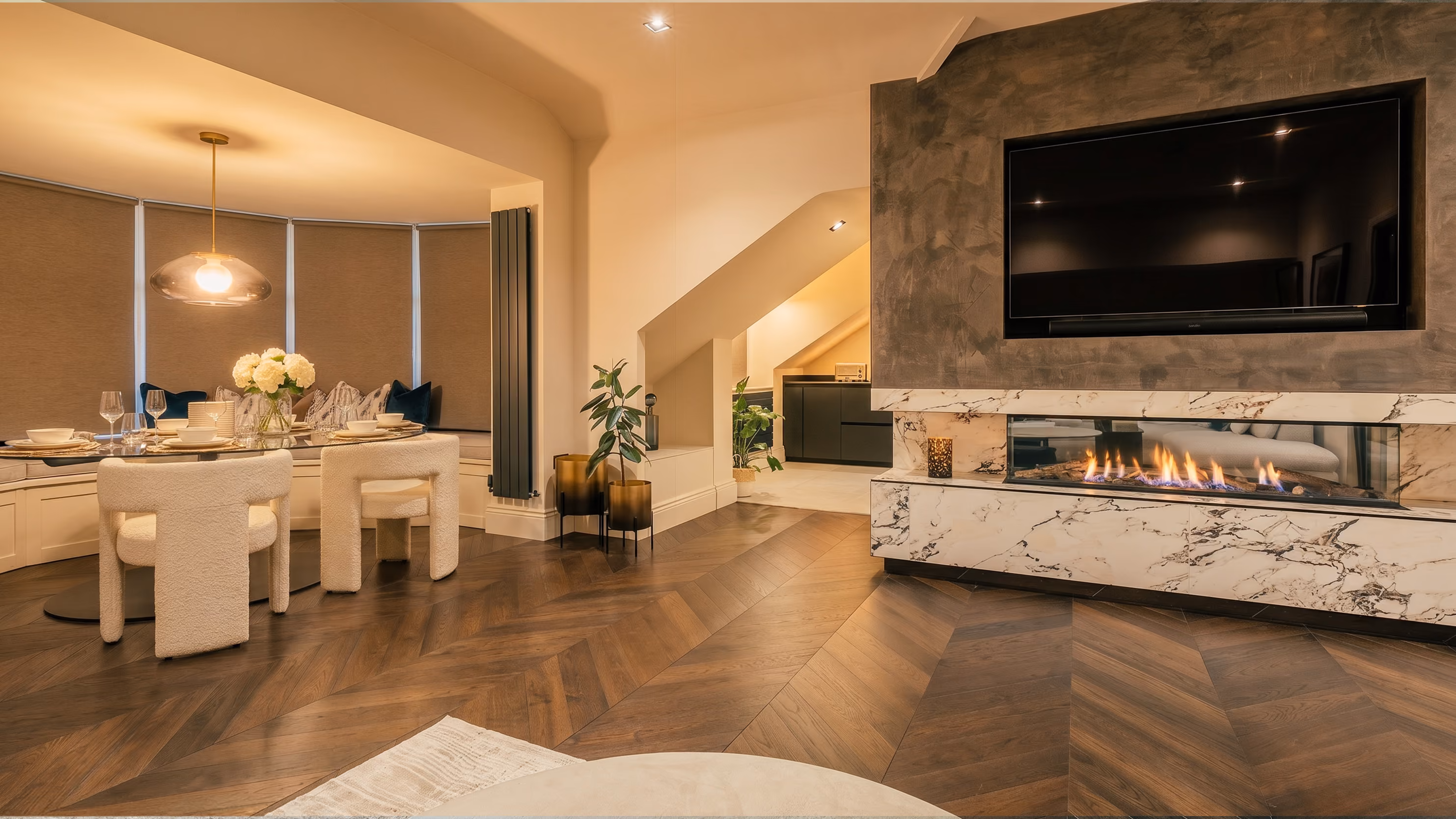 Open-plan living area with a modern fireplace at The Luxury Harrogate Penthouse