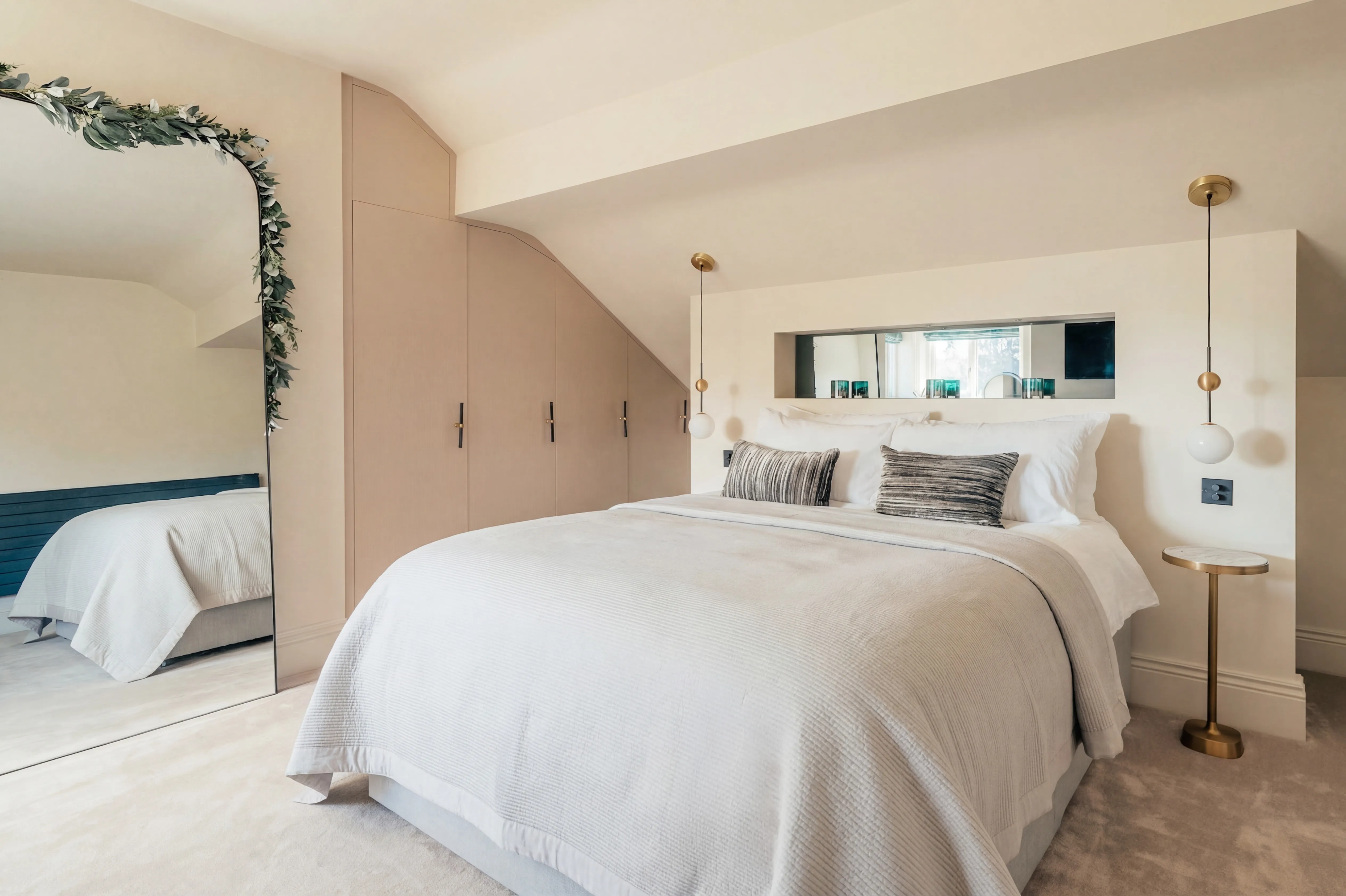 Double bed with fitted wardrobes in a Harrogate short stay apartment
