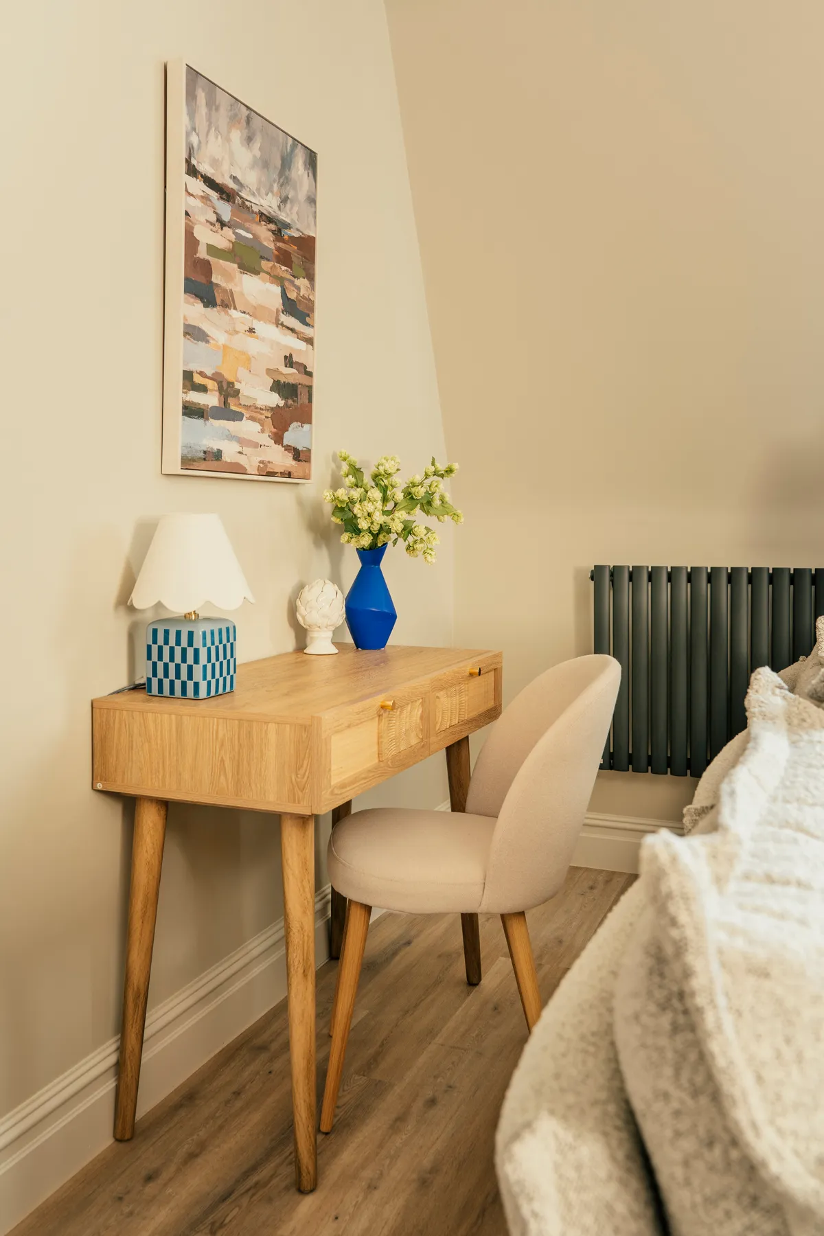 Writing desk with a vase of flowers in a Harrogate holiday apartment