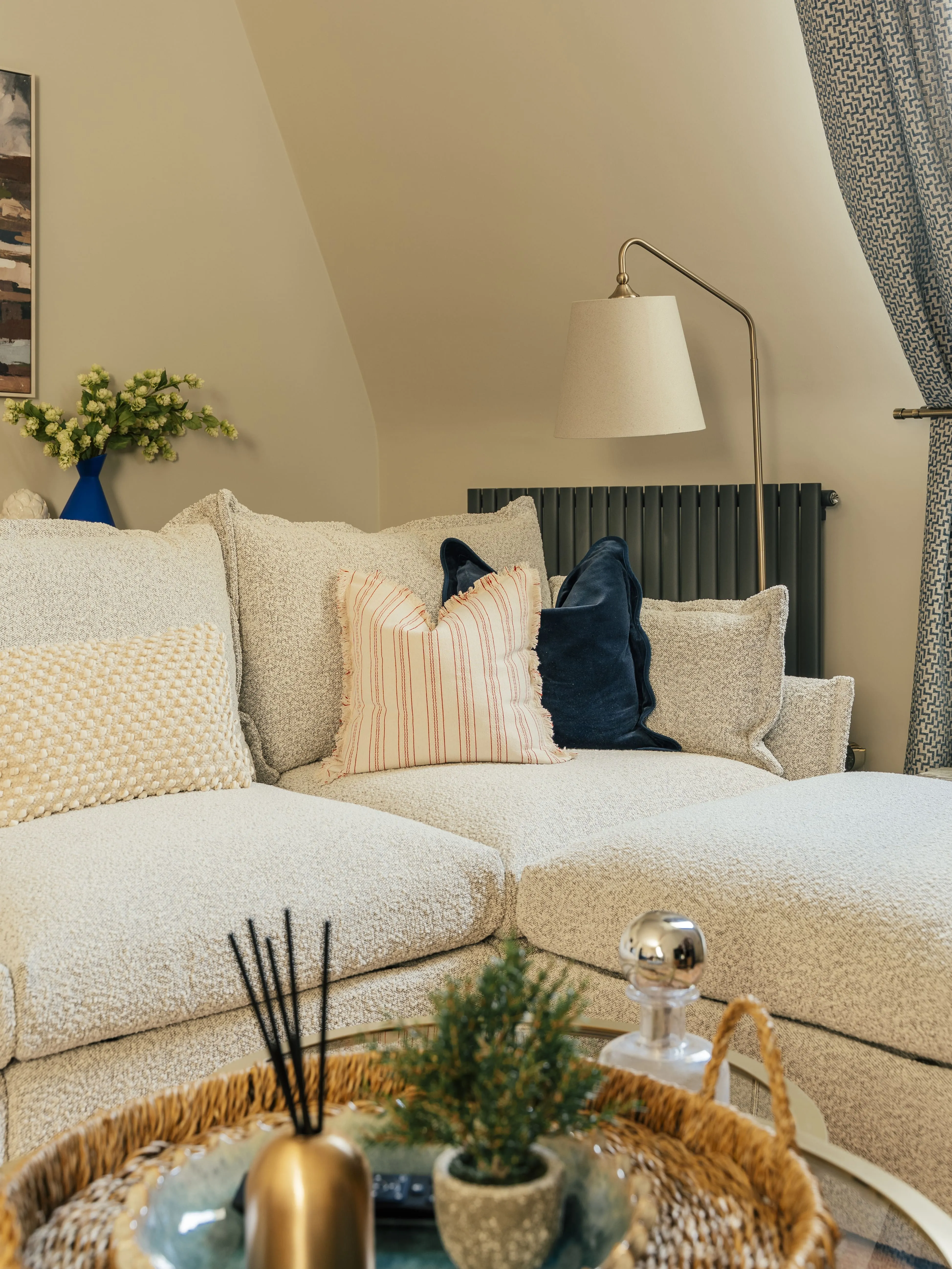 Cream sofa with scatter cushions in a Harrogate short let