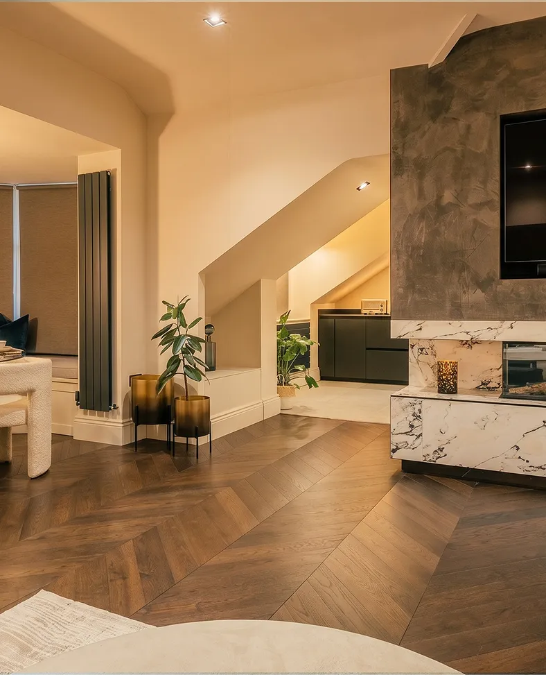 Open-plan living room with a herringbone floor and modern fireplace in a Harrogate penthouse