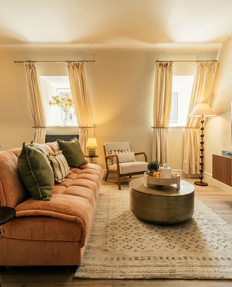 Warm living room with a tan leather sofa in a Harrogate townhouse