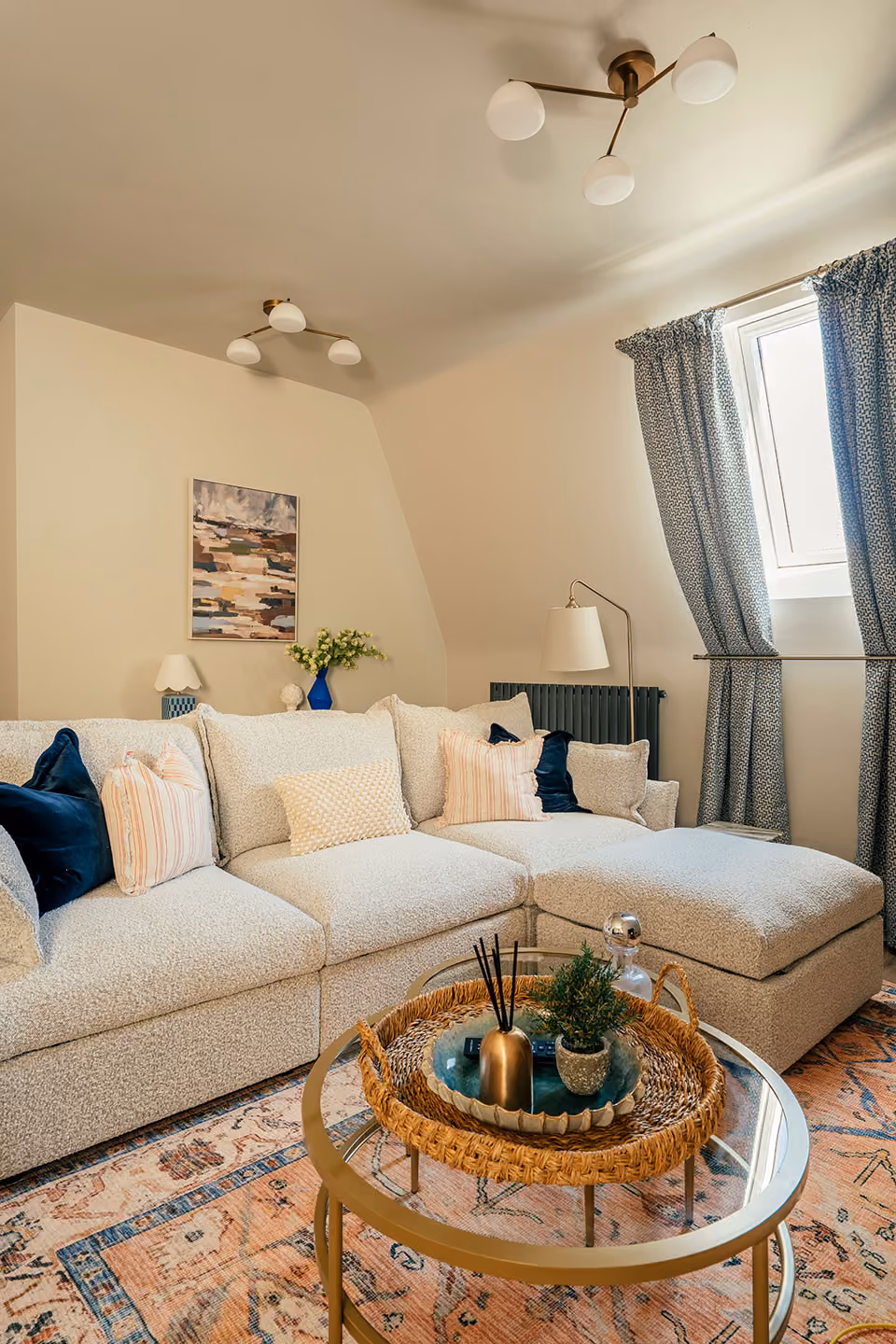 Cream sofa and floral curtains in a Harrogate apartment