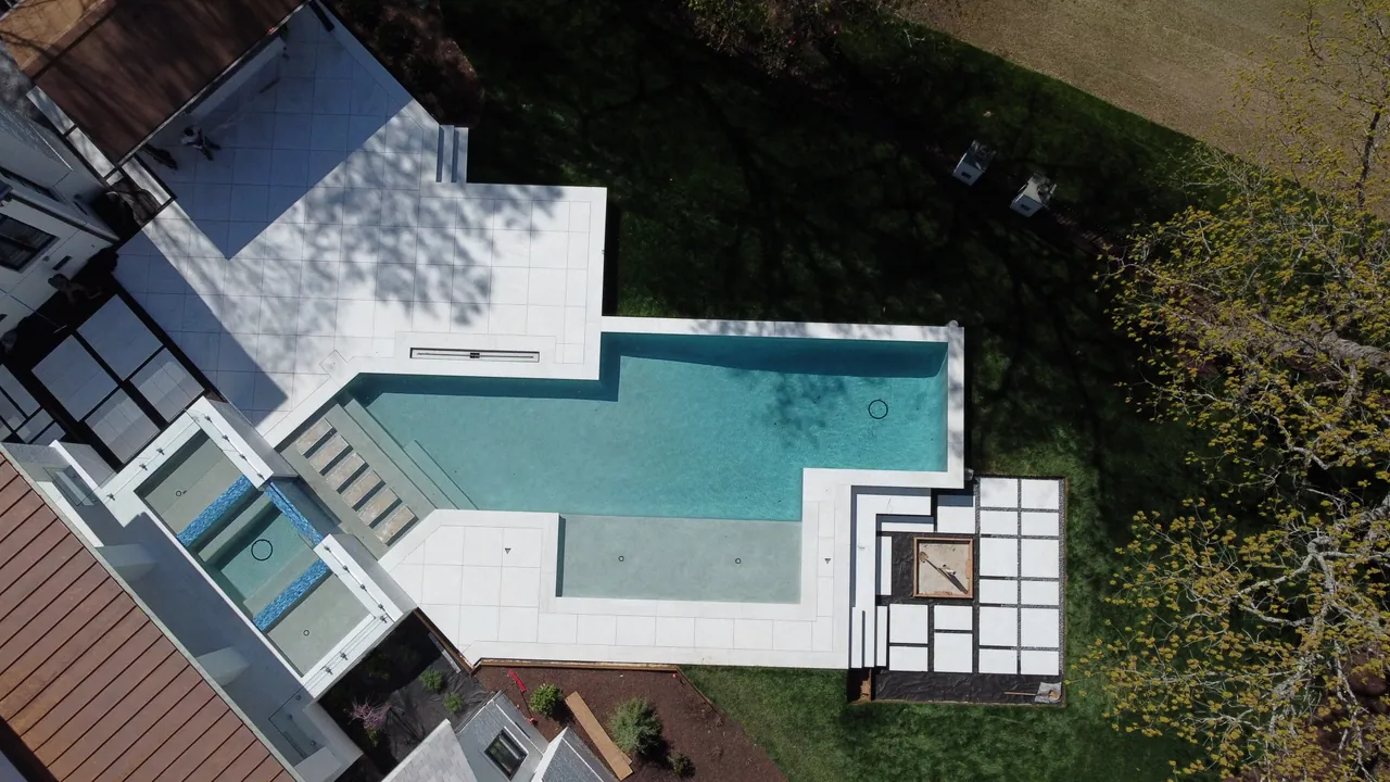 Overhead view of a geometric swimming pool and spa built by Kurt Candler