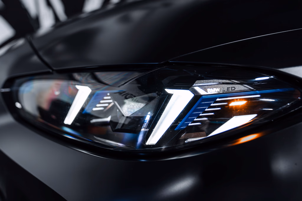 2026 BMW M4 Competition xDrive Frozen Black rear view exotic car rental