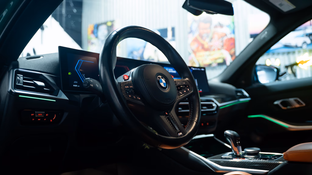 Isle of Man Green BMW M3 Competition xDrive front quarter angle San Diego rental