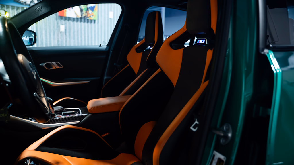 BMW M3 Competition xDrive Isle of Man Green rear angle luxury sedan Irvine rental