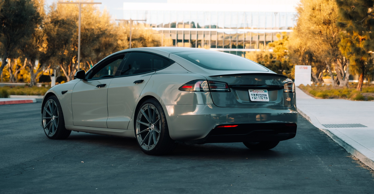 Tesla Model S Plaid side profile Nardo Grey luxury sedan Newport Beach rental