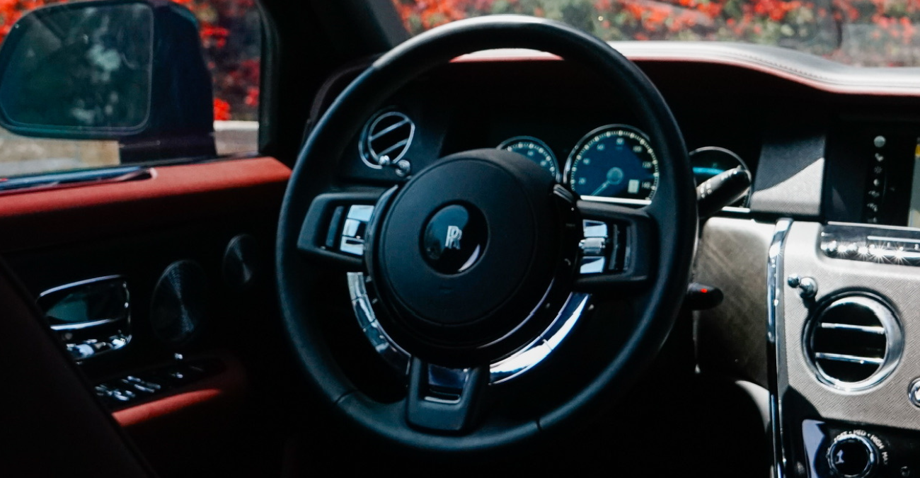 Rolls Royce Cullinan steering wheel and dash Black and Burgundy interior Pacific Coast Highway