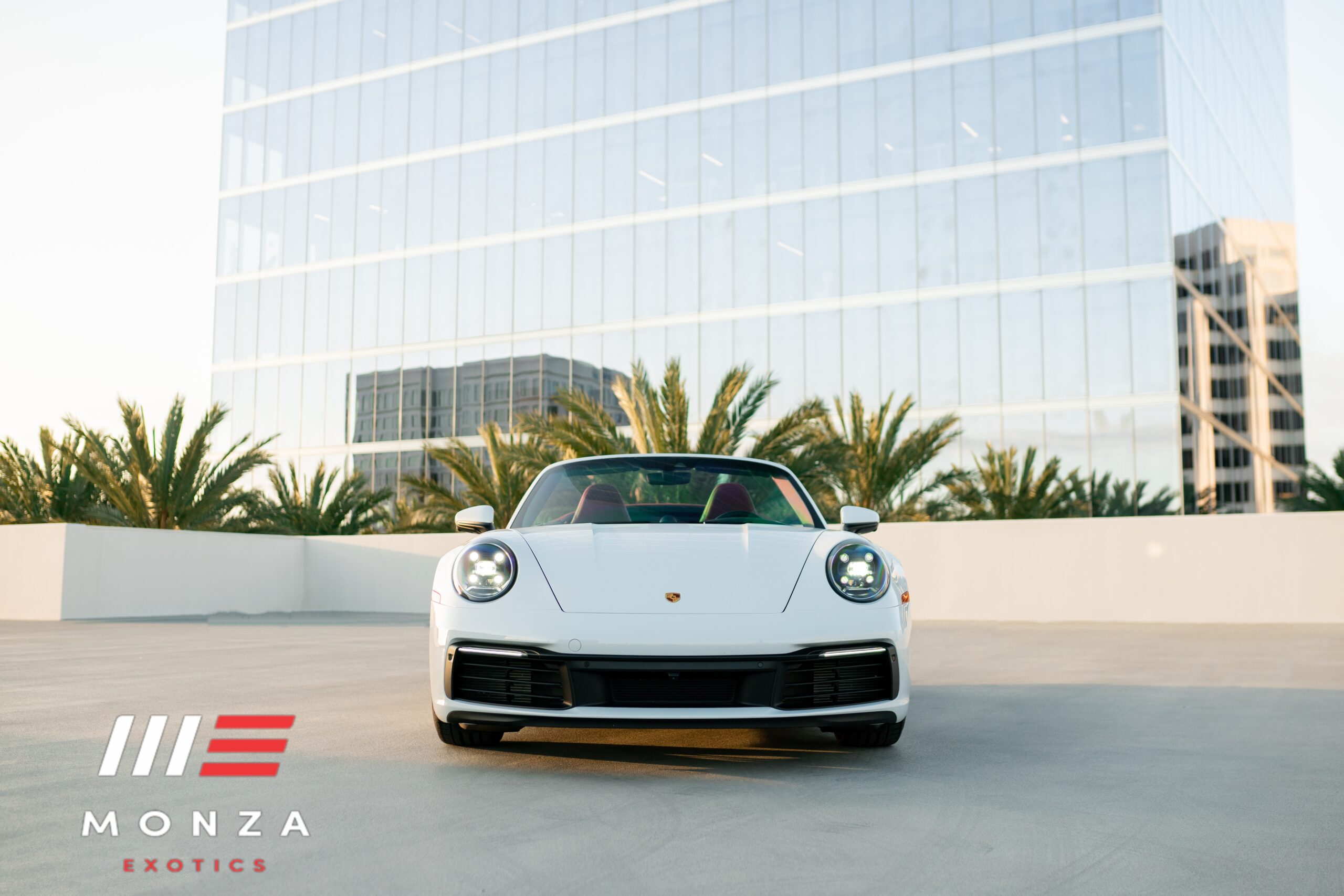 2023 Porsche 911 Carrera 4S Convertible Silver rear view exotic car rental