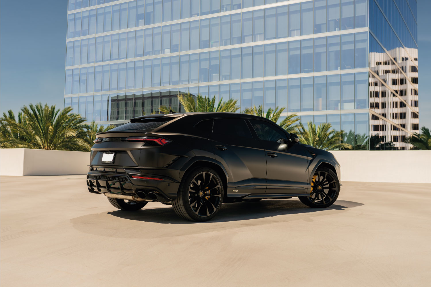 Lamborghini Urus S Black trunk view luxury rental Pacific Coast Highway exotic rental