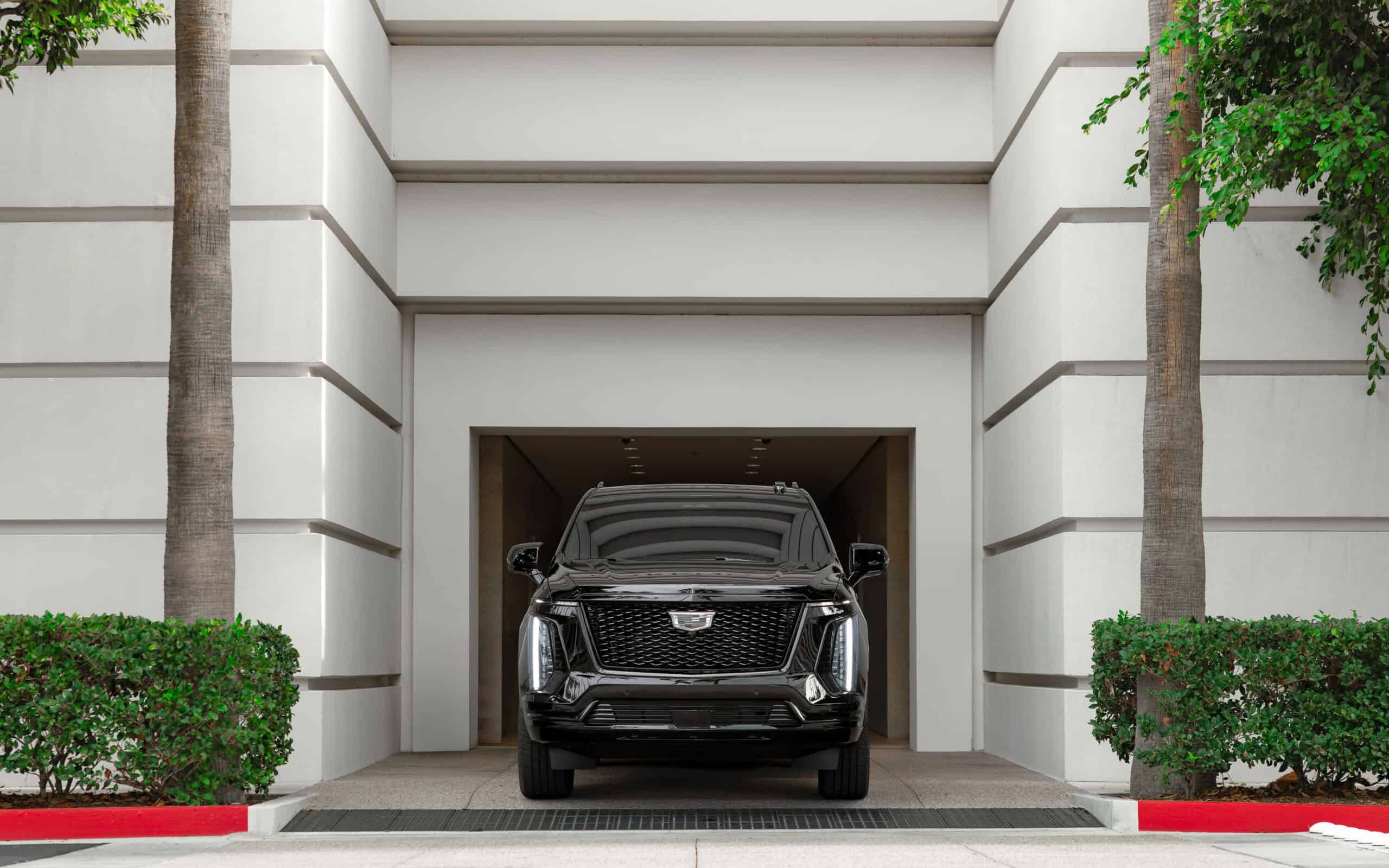 Cadillac Escalade ESV Sport Black rear angle luxury SUV OC rental