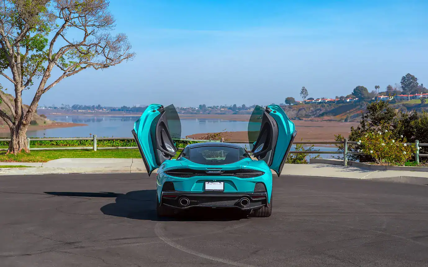McLaren GT Tokyo Cyan rear angle sports car Los Angeles rental