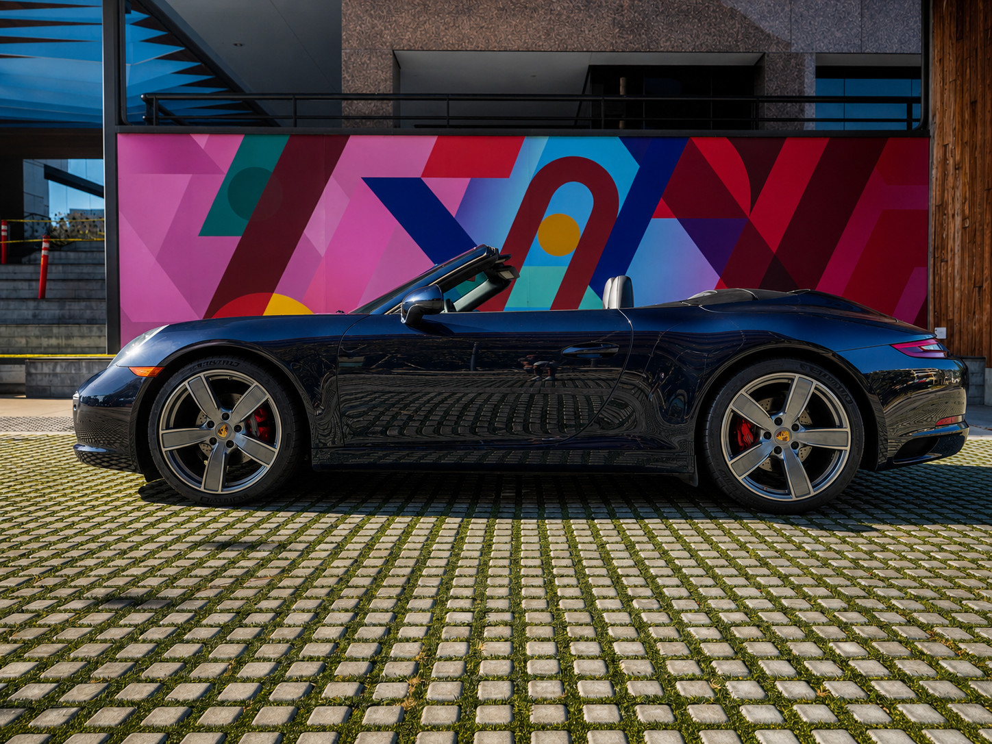 Blue Porsche 911 Carrera convertible sports car available for rent in Orange County