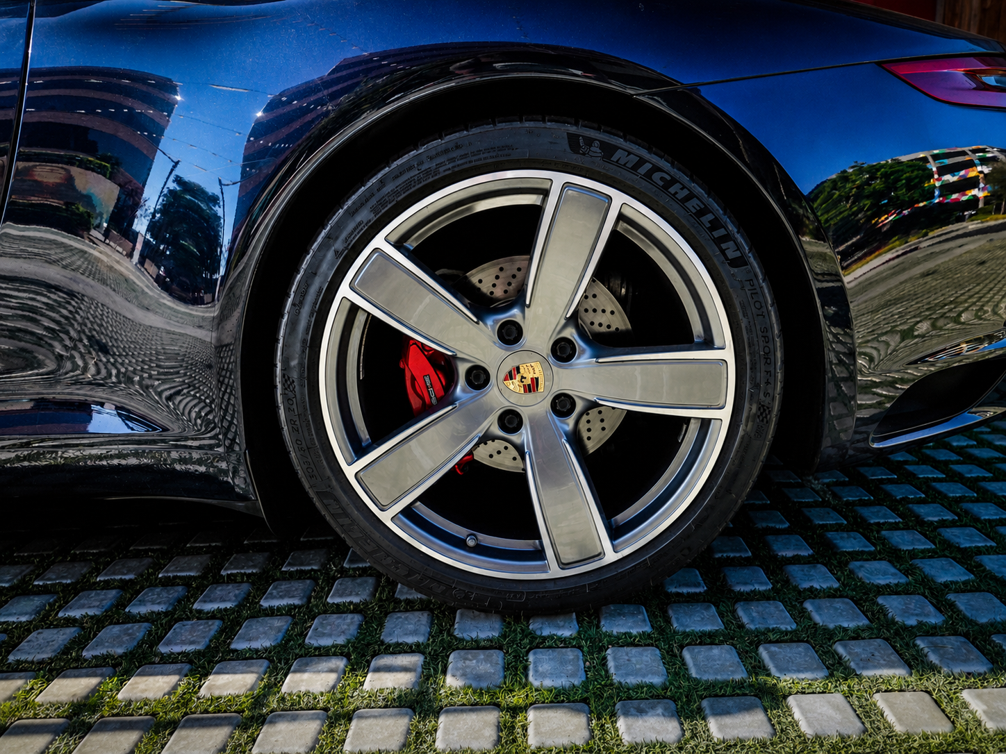 Porsche 911 Carrera alloy wheel with red brake caliper detail