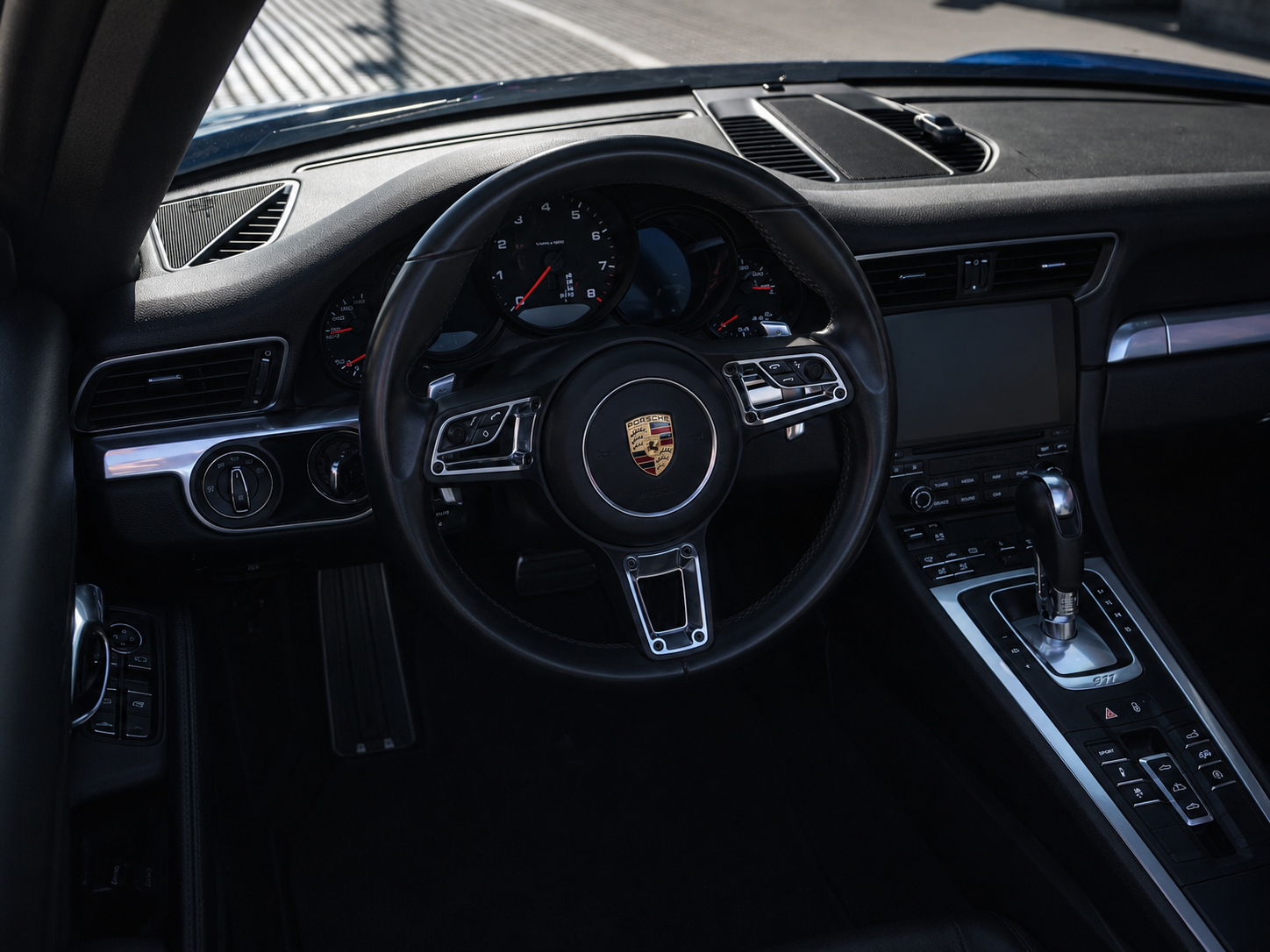 Porsche 911 Carrera cockpit with steering wheel and driver gauges