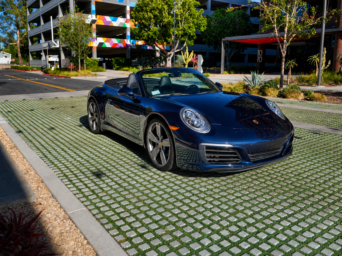 Blue Porsche 911 Carrera convertible front three-quarter view, exotic car rental in Orange County