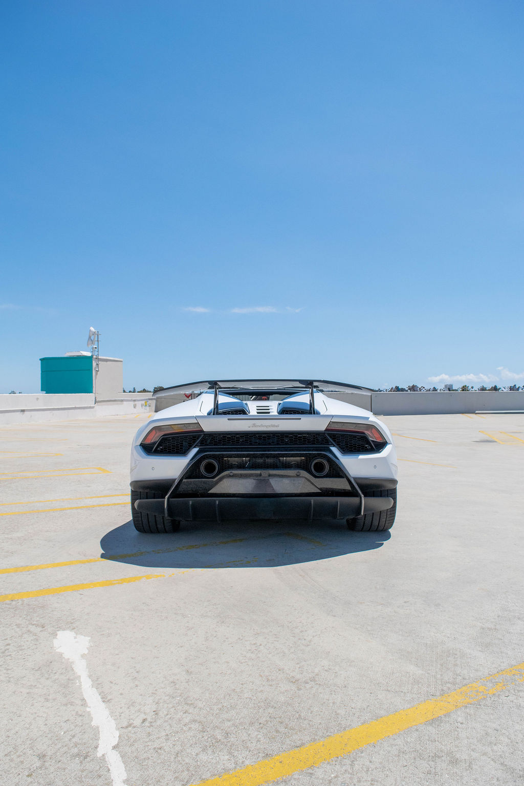 White Lamborghini Huracan rental, a 2 seat supercar with all-wheel drive