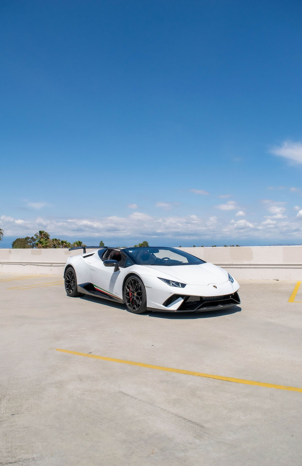 Lamborghini Huracan rental in white, quiet in Strada mode and loud in Corsa