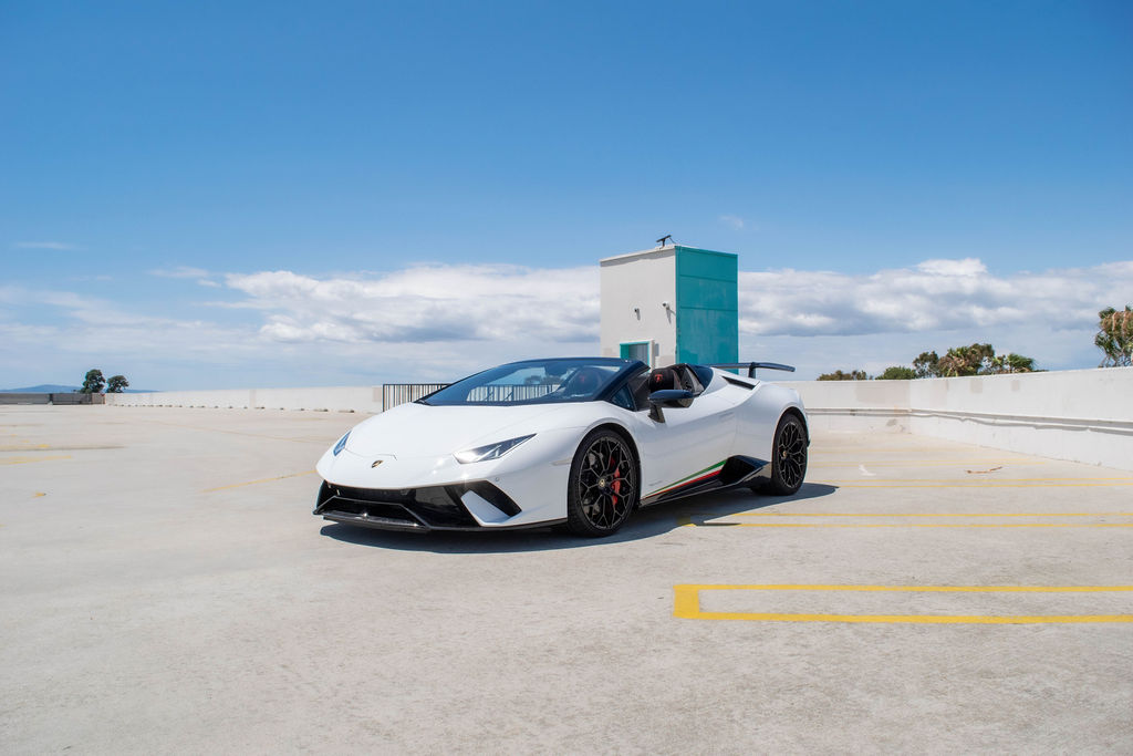 White Lamborghini Huracan rental, reaching 60 mph in 3.1 seconds