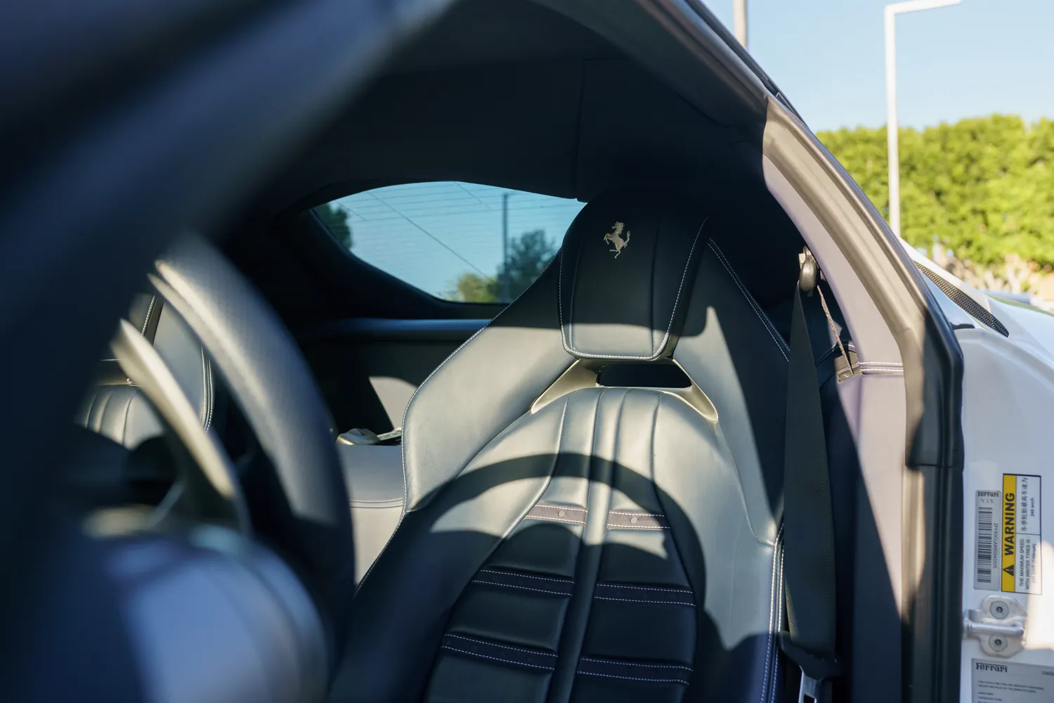 Ferrari 812 Superfast rental in white, a 6.5 liter V12 revving to 8,900 rpm