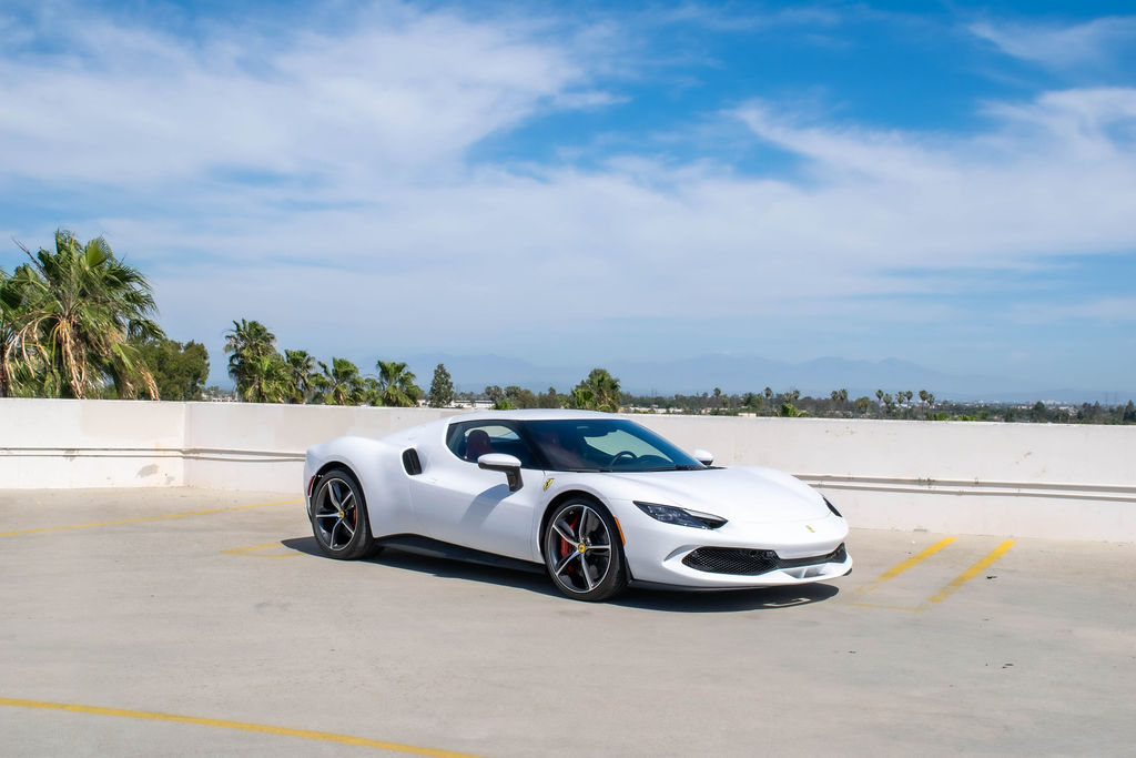 White Ferrari 296 GTB, an 819 hp hybrid V6 supercar to rent in Southern California