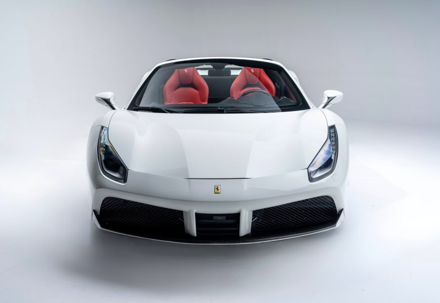 Front view of the white Ferrari 488 Spider rental, a 3.9 liter twin-turbo V8
