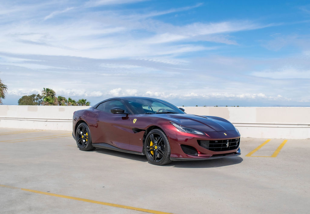 Burgundy Ferrari Portofino, a 4 seat folding hardtop convertible to rent in Southern California