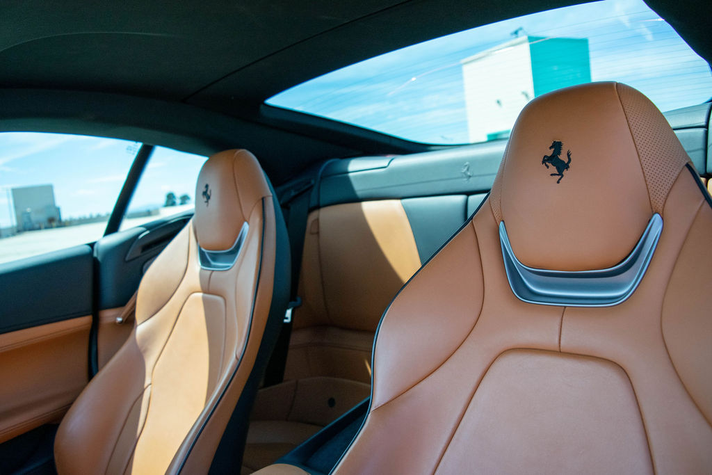 Burgundy Ferrari Portofino rental, a front-engined rear-wheel drive convertible