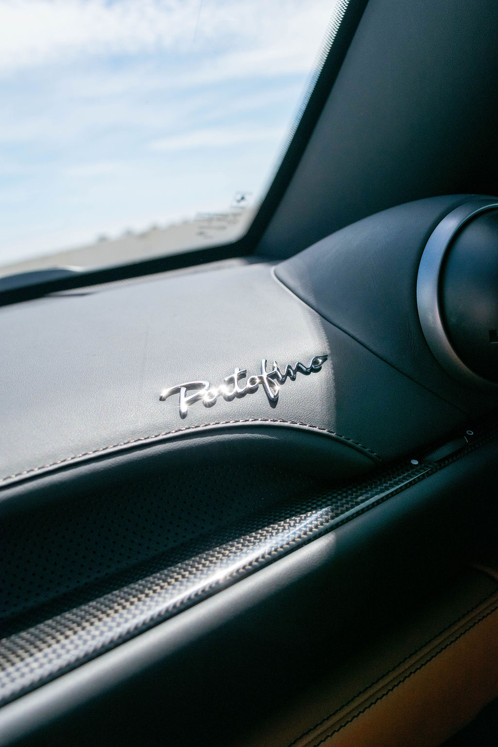 Ferrari Portofino rental in burgundy, a folding hardtop that lowers in 14 seconds