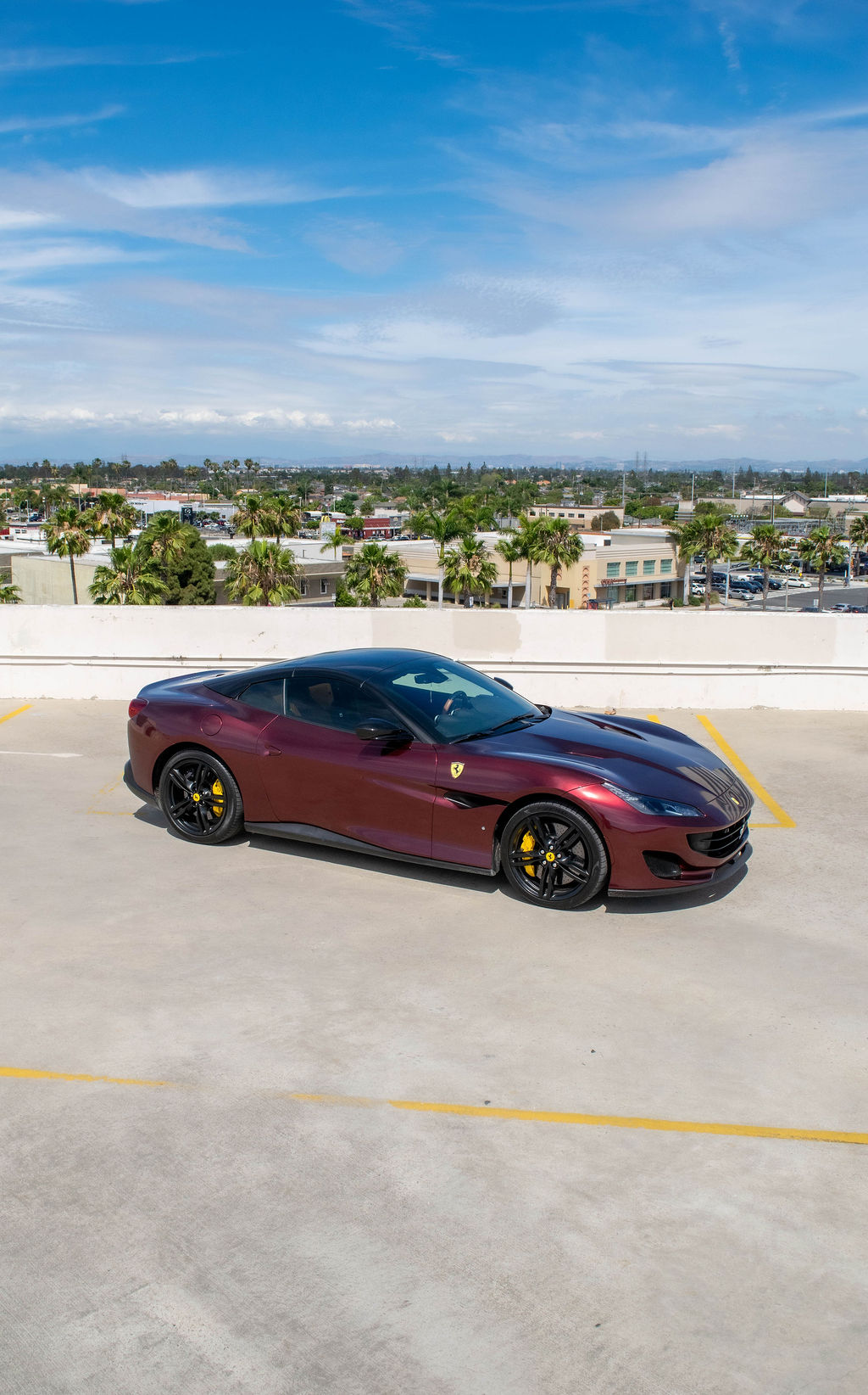 Ferrari Portofino rental in burgundy, a 2 door with a trunk that takes a roller bag