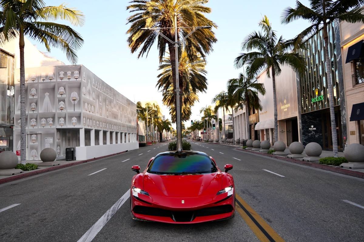 Front view of the red Ferrari SF90 Stradale rental, an all-wheel drive hybrid