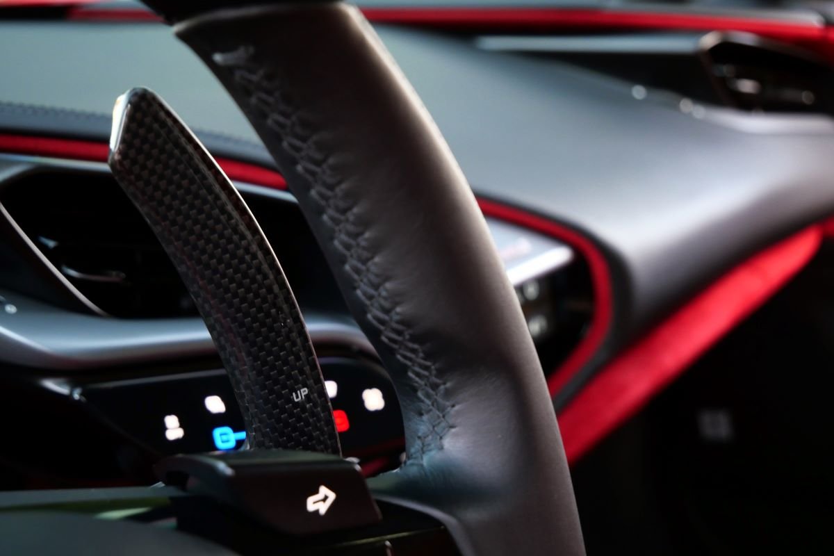 Paddle shifter in the Ferrari SF90 Stradale rental, a 986 hp hybrid supercar