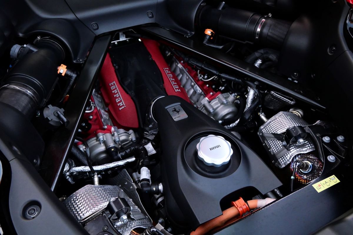 Engine of the red Ferrari SF90 Stradale rental, paired with 3 electric motors