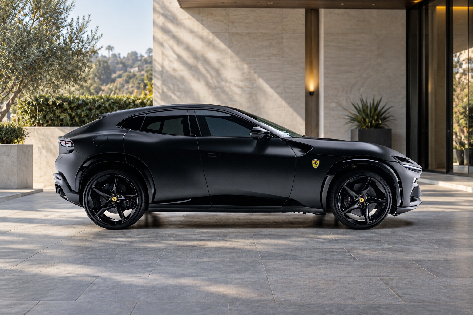 Side view of the black Ferrari Purosangue rental, a 4 door V12 with a 193 mph top speed