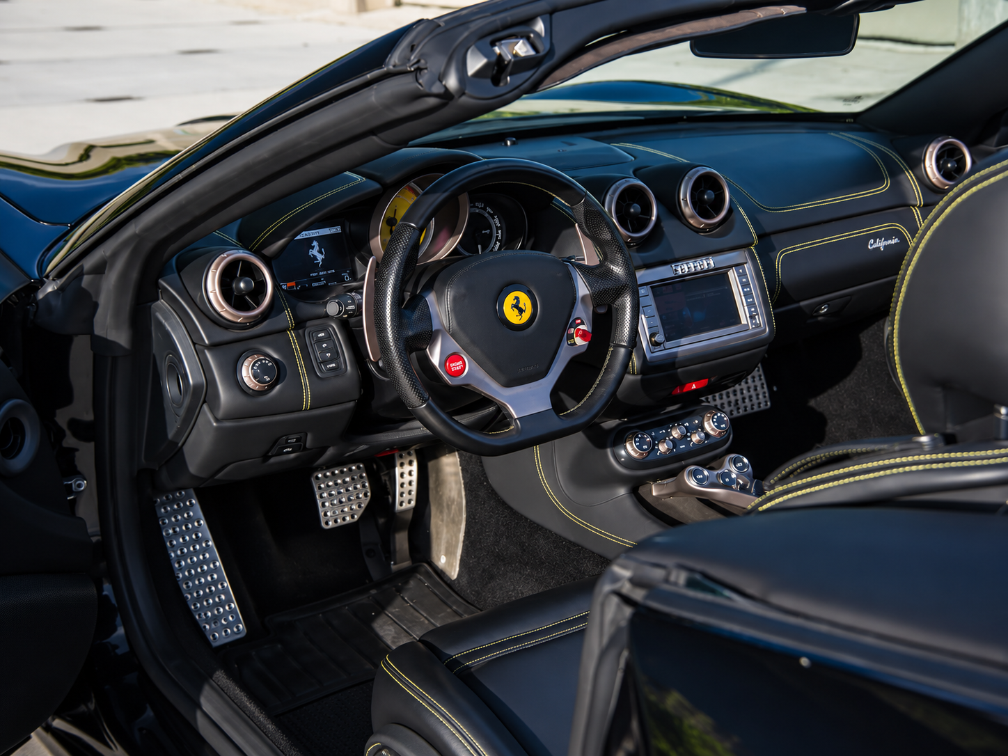 Steering wheel in the Ferrari California T rental, a folding hardtop Ferrari