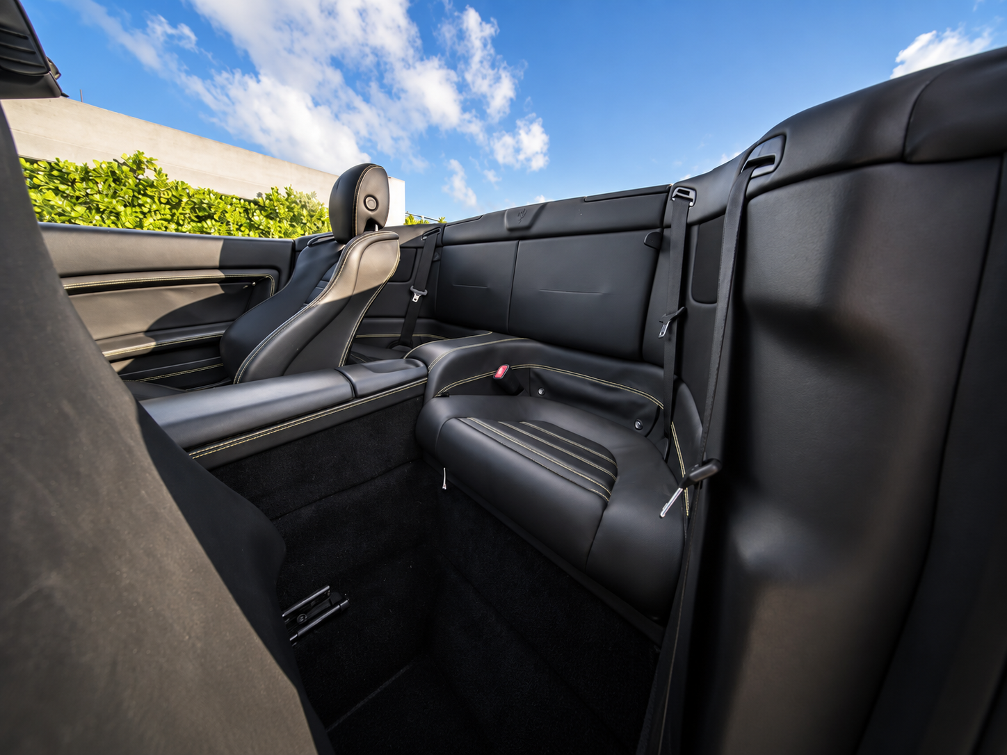 Rear seats in the Ferrari California T rental, sized for a child or luggage