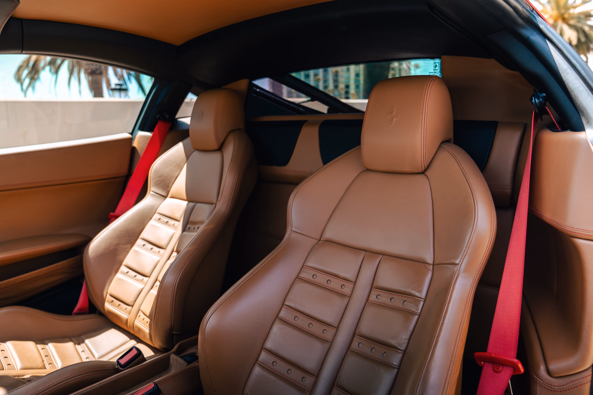 Tan seats inside the Ferrari 458 Italia rental, a 2 seat supercar