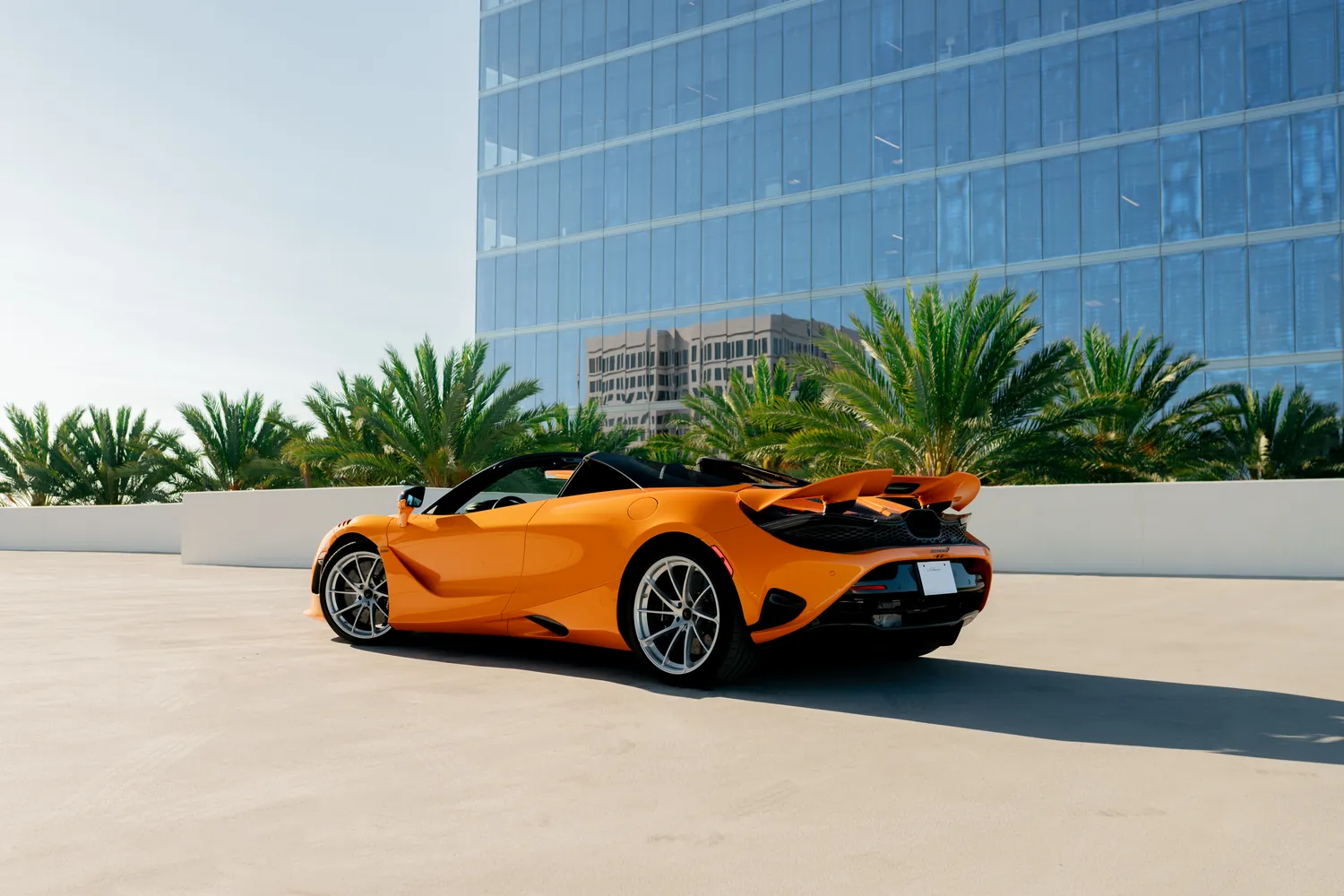 Orange McLaren 750S Spider rental, a mid-engine 2 seat convertible