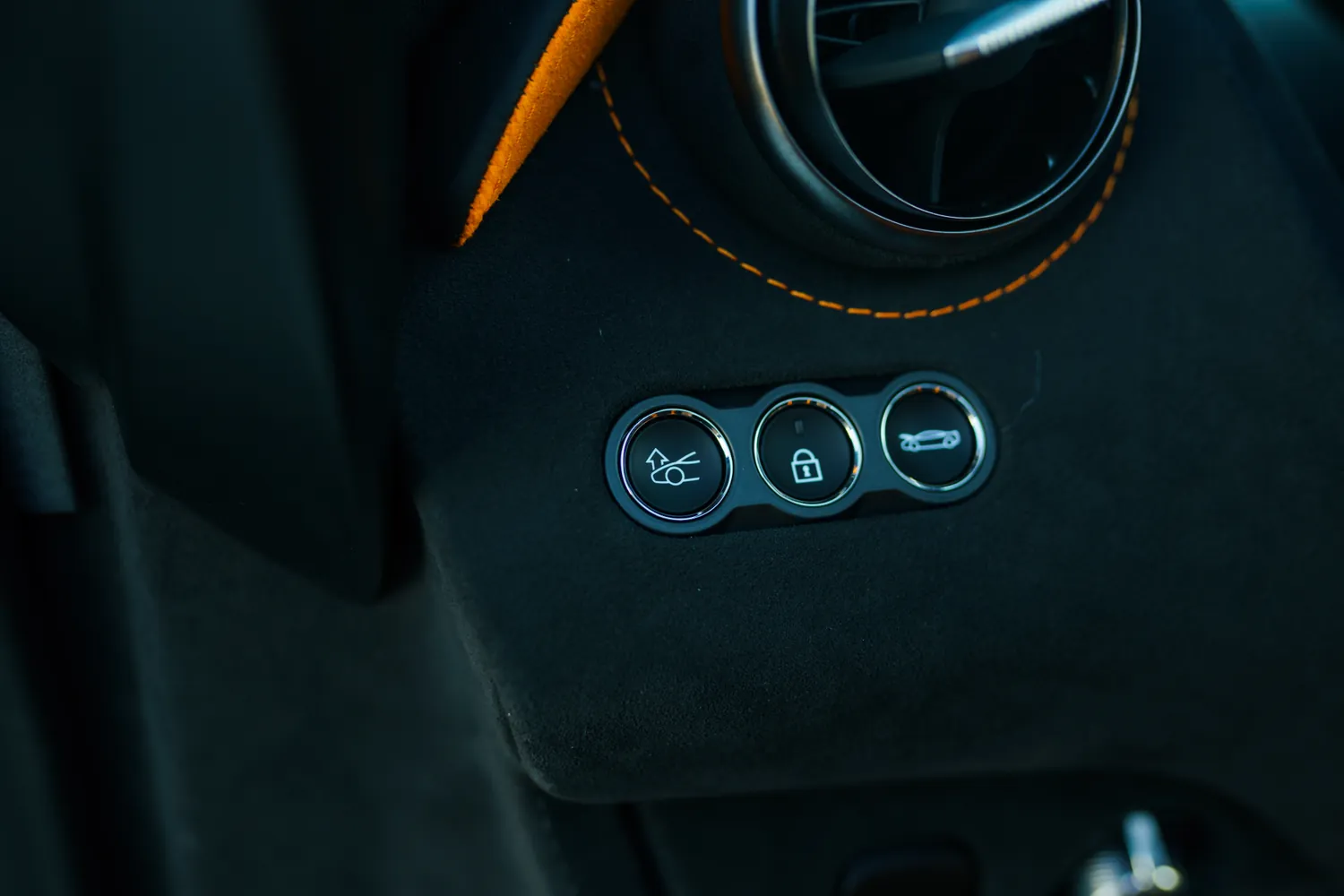 McLaren 750S Spider rental in orange, with a carbon roof that opens in 11 seconds