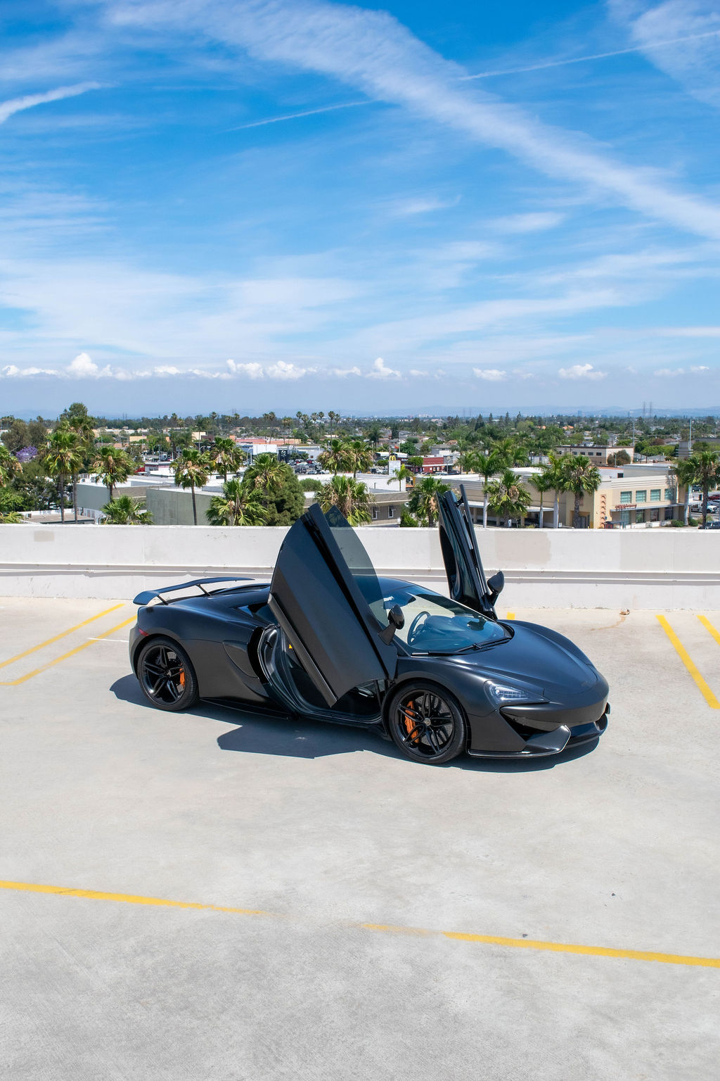 McLaren 570S rental, a 562 hp twin-turbo V8 supercar in black