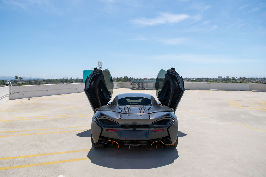 McLaren 570S rental in black, a 2 seat coupe with a 150 liter front trunk